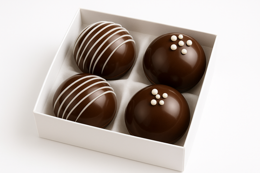 can-you-make-a-pic-of-4-choclatebombs-in-glossy-glykosbombs-with-easy-designs-with-white-choclate-in-a-white-easy-giftbox-with-white-background