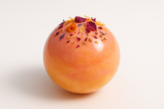 can-you-make-a-pic-of-sunrise-bloom-tea-bomb-in-a-glossy-glykos-bomb-with-some-dried-floder-on-and-white-background